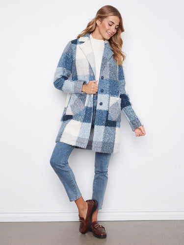 Cozy coat with a button closure, perfect for chilly days, featuring a stylish design by Charlie B.