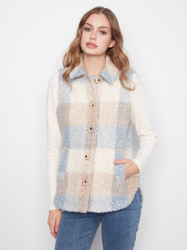 Button details enhance the classic look of this sleeveless plaid vest, making it an essential piece in cooler weather. By Charlie B.