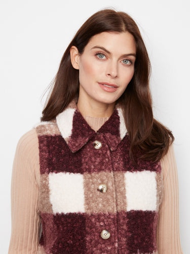 A stylish plaid vest with a classic shirt collar, adding a touch of elegance to your casual wardrobe. Perfect for layering. By Charlie B.