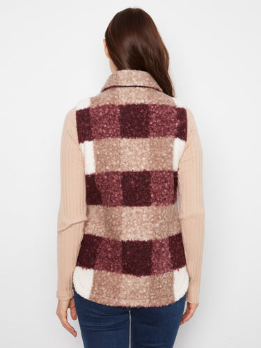 Versatile plaid vest with classic shirt collar design, offering timeless appeal and comfort for everyday wear throughout the seasons. By Charlie B.