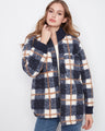 Plaid jacket featuring a convenient zip-front closure, ideal for layering in cooler weather. Crafted with style by Charlie B.