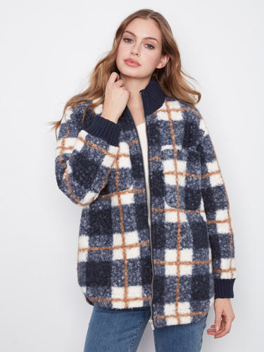 Plaid jacket featuring a convenient zip-front closure, ideal for layering in cooler weather. Crafted with style by Charlie B.