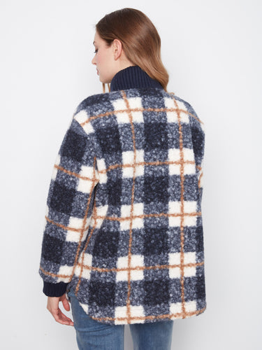 Cozy plaid jacket equipped with practical chest pockets for added functionality and flair. Created by Charlie B.