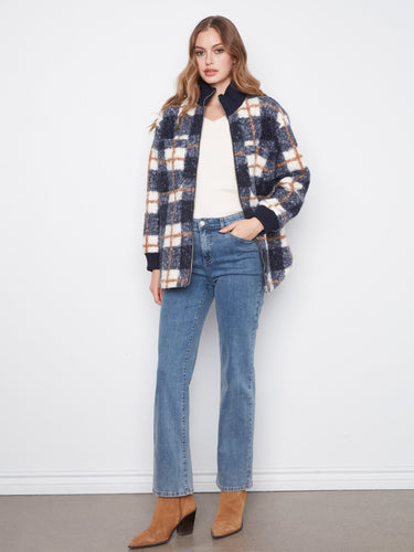 Elegant plaid jacket designed with ribbed cuffs that ensure comfort and warmth during chilly days. Tailored by Charlie B.