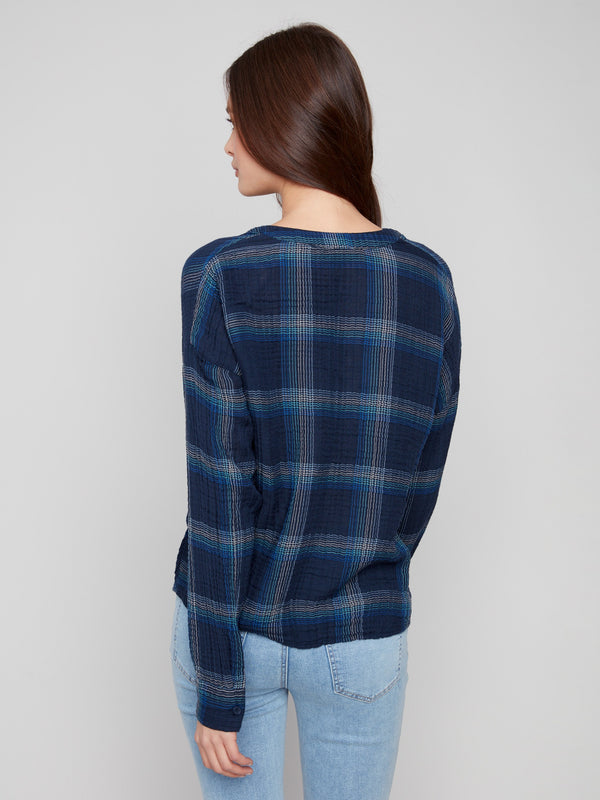 Stylish blue plaid blouse showcasing a unique front knot detail for added flair by Charlie B.