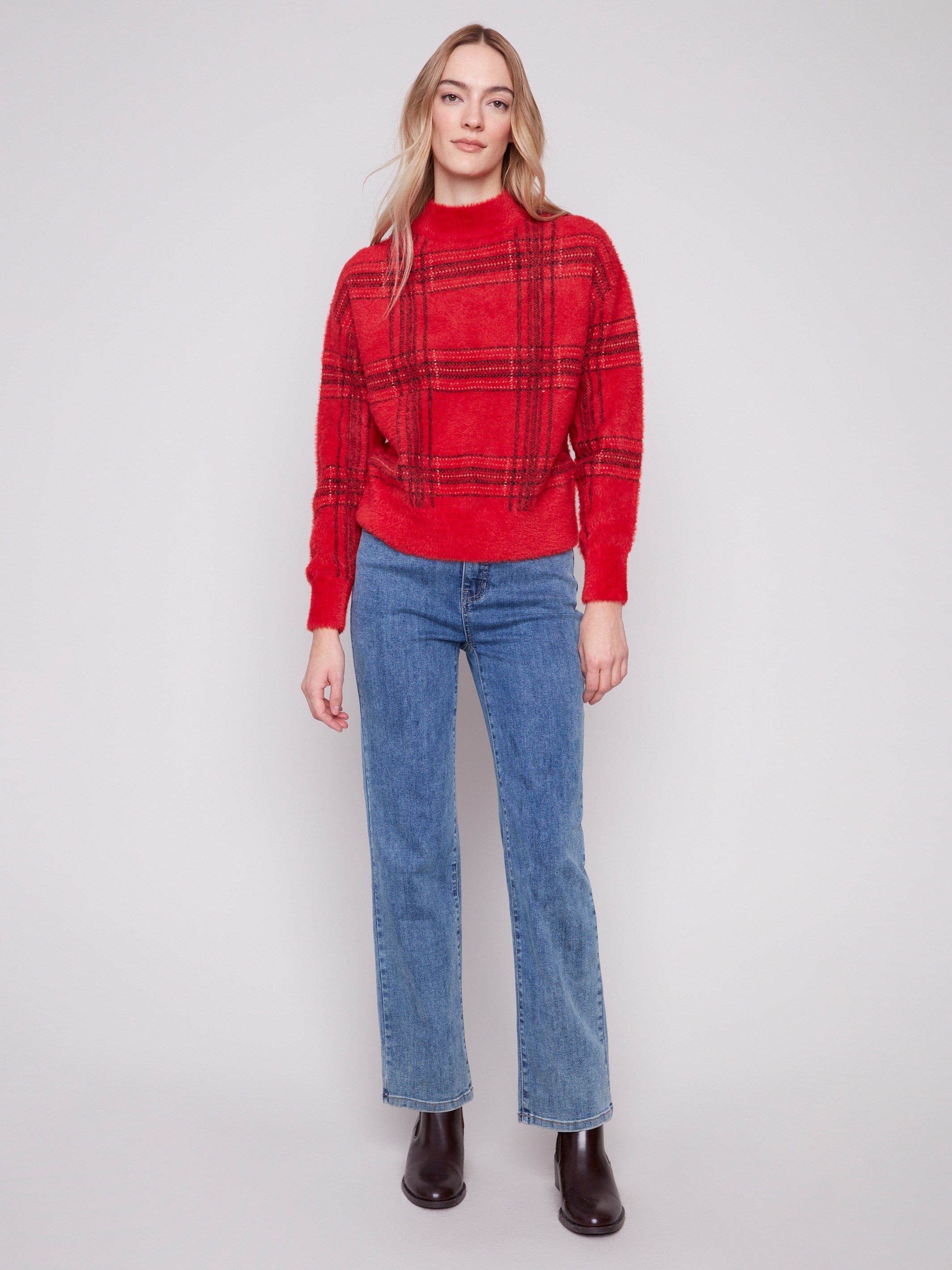 Featuring an eyelash fabric, this red plaid sweater offers both style and comfort by Charlie B.