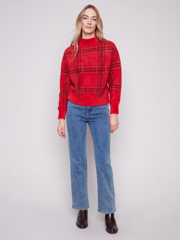 Featuring an eyelash fabric, this red plaid sweater offers both style and comfort by Charlie B.