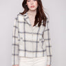 Beige plaid short coat with tailored collar and long sleeves, featuring hidden snap buttons and welt pockets by Charlie B.