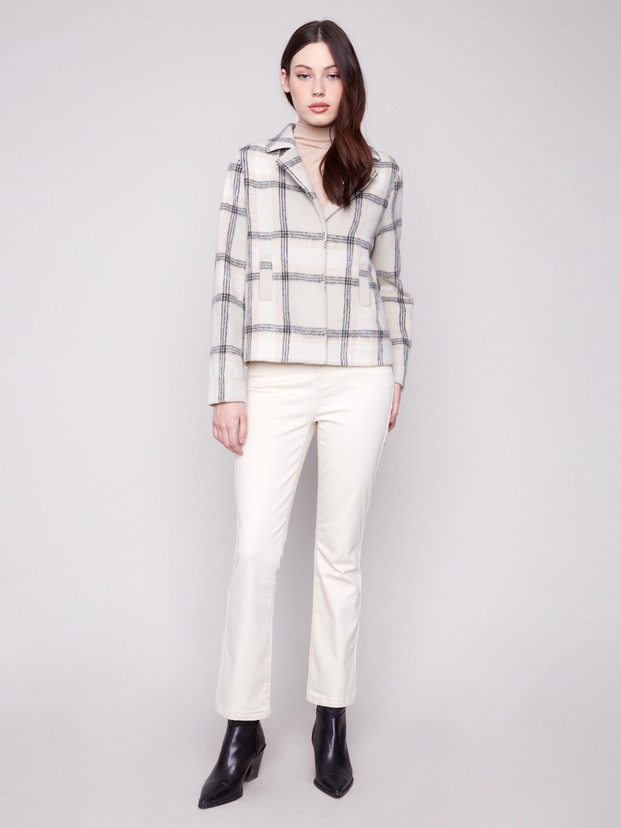 Beige plaid short coat enhanced with lurex thread for a subtle shine, featuring classic collar and welt pockets by Charlie B.