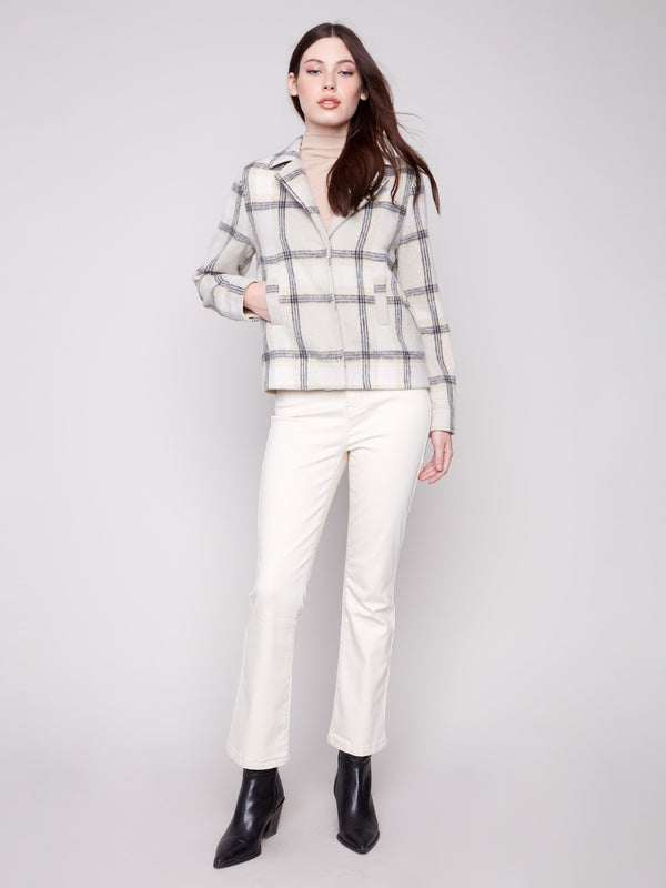 Elegant beige plaid short coat boasting stylish welt pockets, long sleeves, and a refined classic collar by Charlie B.