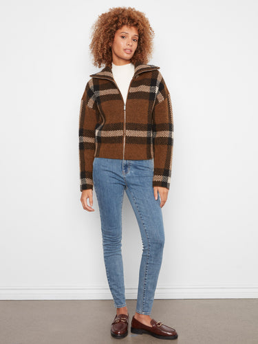Stylish plaid jacket with a convenient zip-up closure, ideal for layering in cooler weather. By Charlie B.