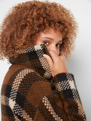 This elegant plaid jacket is designed with attention to detail and quality craftsmanship. A must-have by Charlie B.
