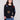 Black plush sweater with a classic crew neckline adorned with colorful boucle flower patches for a vibrant touch by Charlie B.