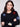 Cozy black sweater in plush fabric, enhanced by colorful boucle flower patterns for a playful look by Charlie B.