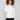 Ecru plush sweater featuring raglan sleeves and intricate heart cross-stitch, perfect for cozy days by Charlie B.