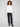 This ecru sweater showcases a unique zipper detail adding a modern touch to its classic design by Charlie B.