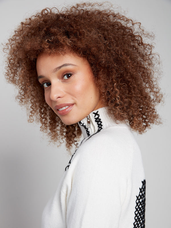 Stylish ecru sweater exhibiting sophisticated raglan sleeves and luxurious feel by Charlie B.