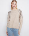 Elegant sweater featuring a crew neckline with sequin details on the shoulders, adding a touch of sparkle. By Charlie B.