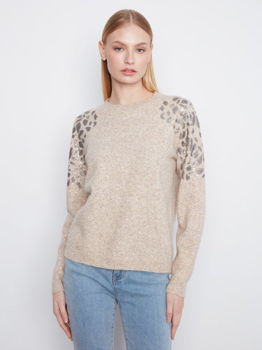 Elegant sweater featuring a crew neckline with sequin details on the shoulders, adding a touch of sparkle. By Charlie B.