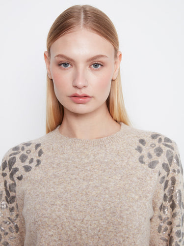 Stylish long-sleeve sweater with shimmering sequin accents on the shoulders, perfect for any occasion. By Charlie B.