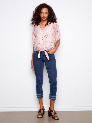 Chic pink blouse with polka dots and an elegant front tie knot, perfect for casual outings by Charlie B.