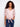 Trendy semi-sheer pink blouse with playful polka dots and short dolman sleeves for added style by Charlie B.