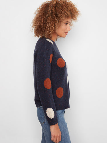 Elegant navy sweater with ribbed cuffs, offering comfort and style with its playful polka dot motif by Charlie B.