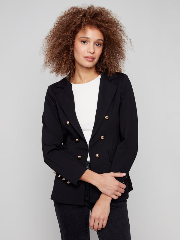 Black blazer with a stylish notch lapel collar, paired elegantly with gold buttons for a chic look by Charlie B.