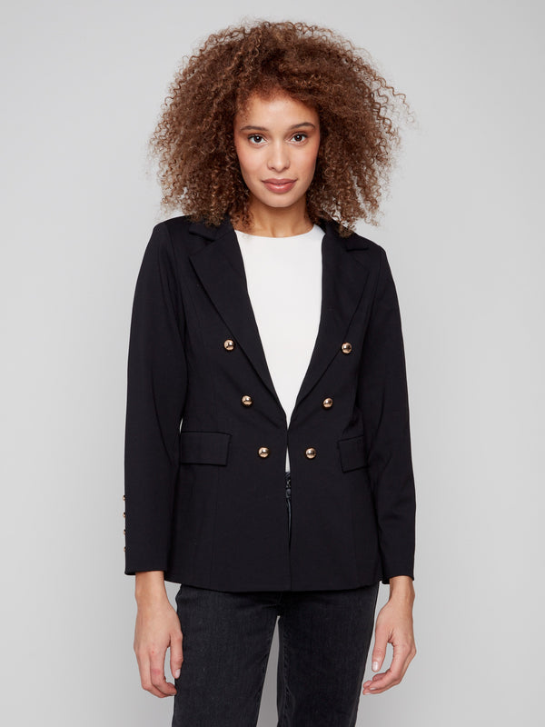Elegant black blazer adorned with striking gold button details and practical flap pockets by Charlie B.
