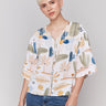 Blouse with a V-neck and decorative buttons by Charlie B.