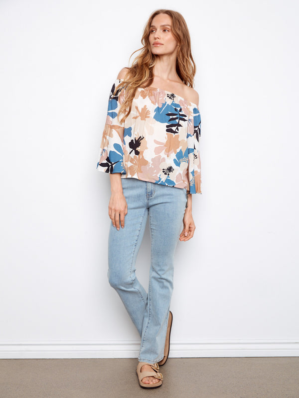The 3/4 sleeves add a touch of elegance, making this floral top ideal for various occasions. By Charlie B.