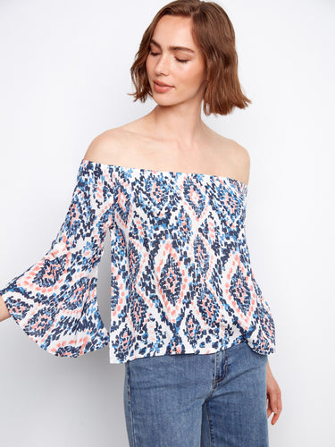 Stylish off-shoulder blouse with 3/4 sleeves and an eye-catching abstract print by Charlie B.