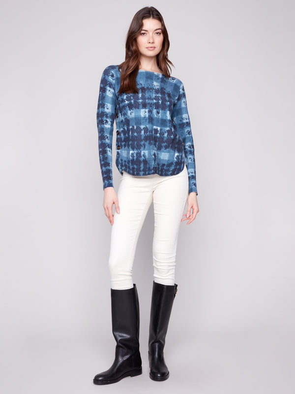 Shadow print sweater featuring side button details and a stylish rounded hem by Charlie B.