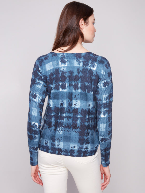 Stylish shadow print sweater featuring ribbed sleeves and distinctive boat neck design by Charlie B.