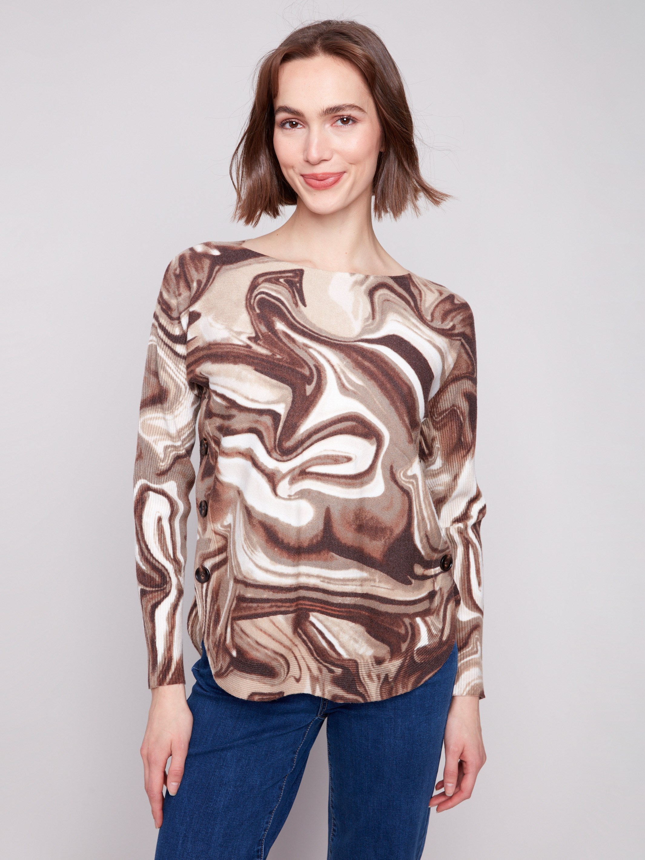 Swirl print sweater with ribbed sleeves, showcasing a chic design for stylish comfort by Charlie B.