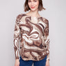 Swirl print sweater with ribbed sleeves, showcasing a chic design for stylish comfort by Charlie B.