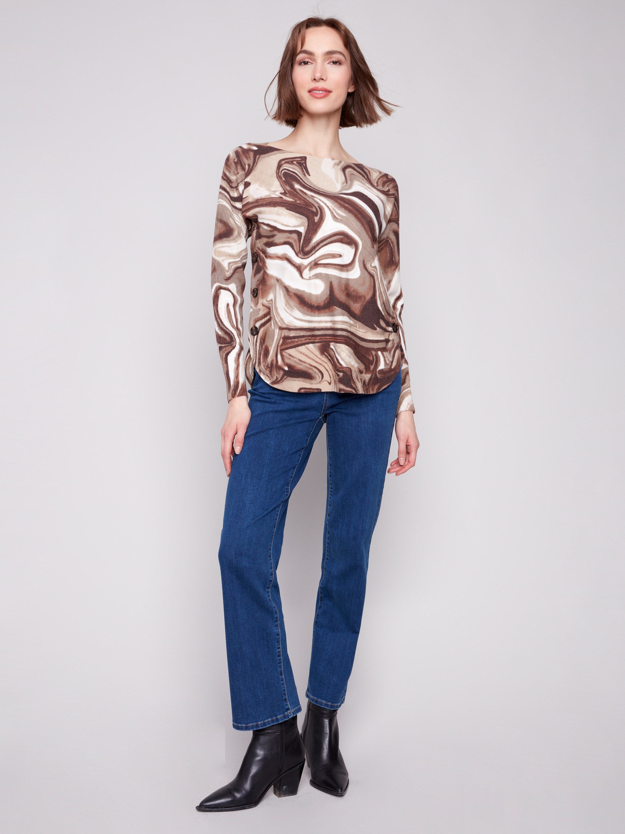 Elegant sweater featuring a rounded hem and eye-catching swirl pattern for a modern look by Charlie B.