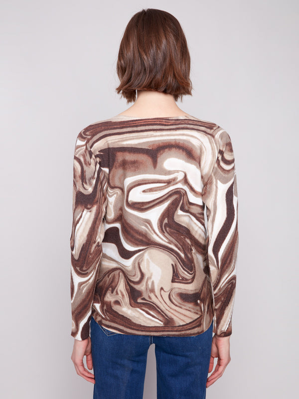 Chic sweater with boat neck and unique swirl print, perfect for versatile styling by Charlie B.