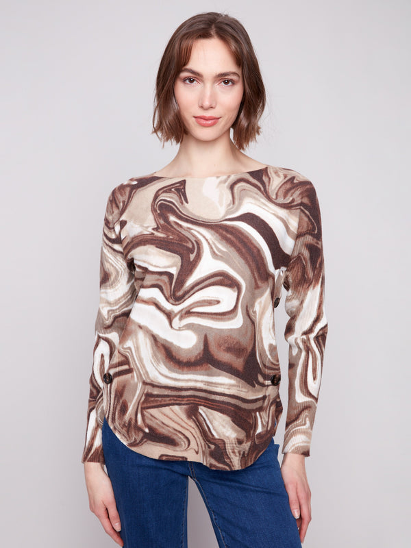 Sweater with side buttons detail, adding flair to the swirl design by Charlie B.