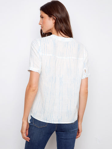 Stylish white blouse with rolled short sleeves and delicate blue stripes, offering a relaxed fit by Charlie B.