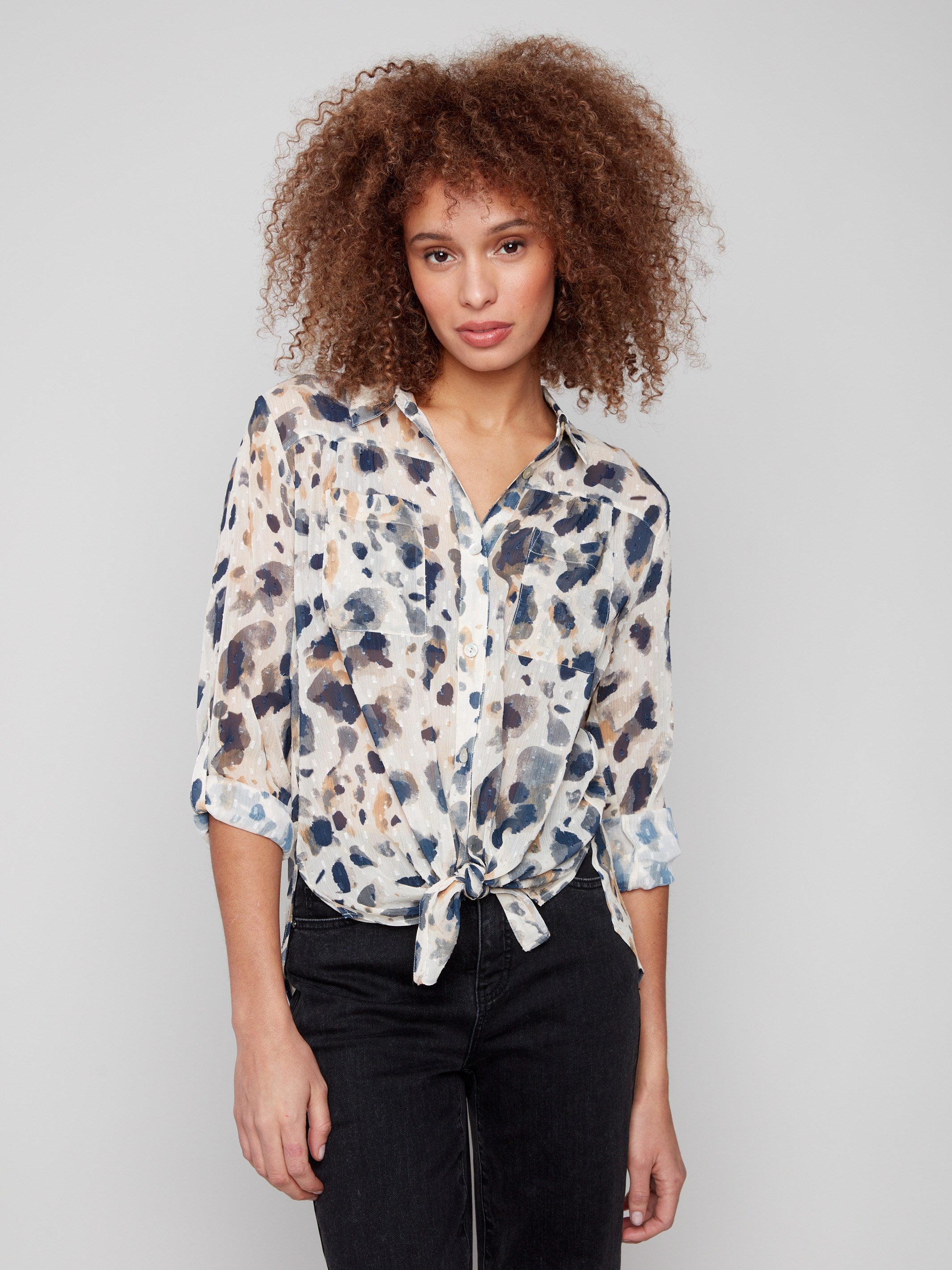 Blouse featuring a stylish tie-front option and animal pattern by Charlie B.