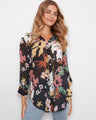 Floral print blouse with a shirt collar and button-front closure, perfect for casual outings by Charlie B.