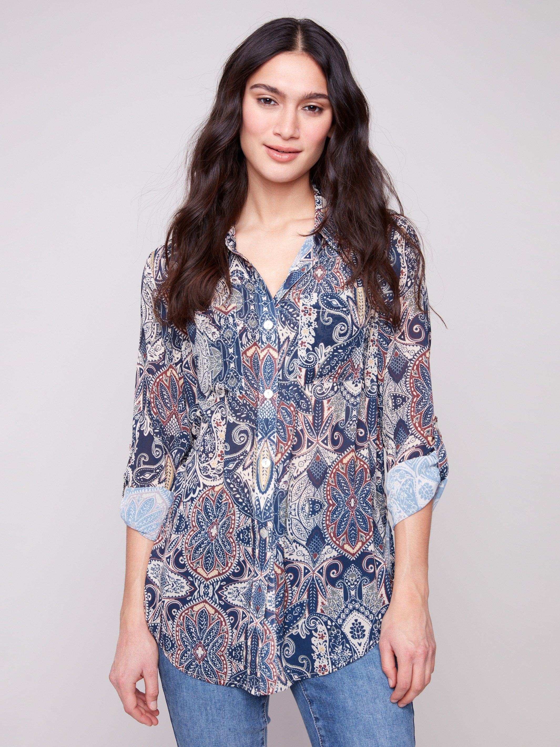 Paisley blouse with adjustable roll-up sleeves and chest pockets, perfect for versatile styling by Charlie B.