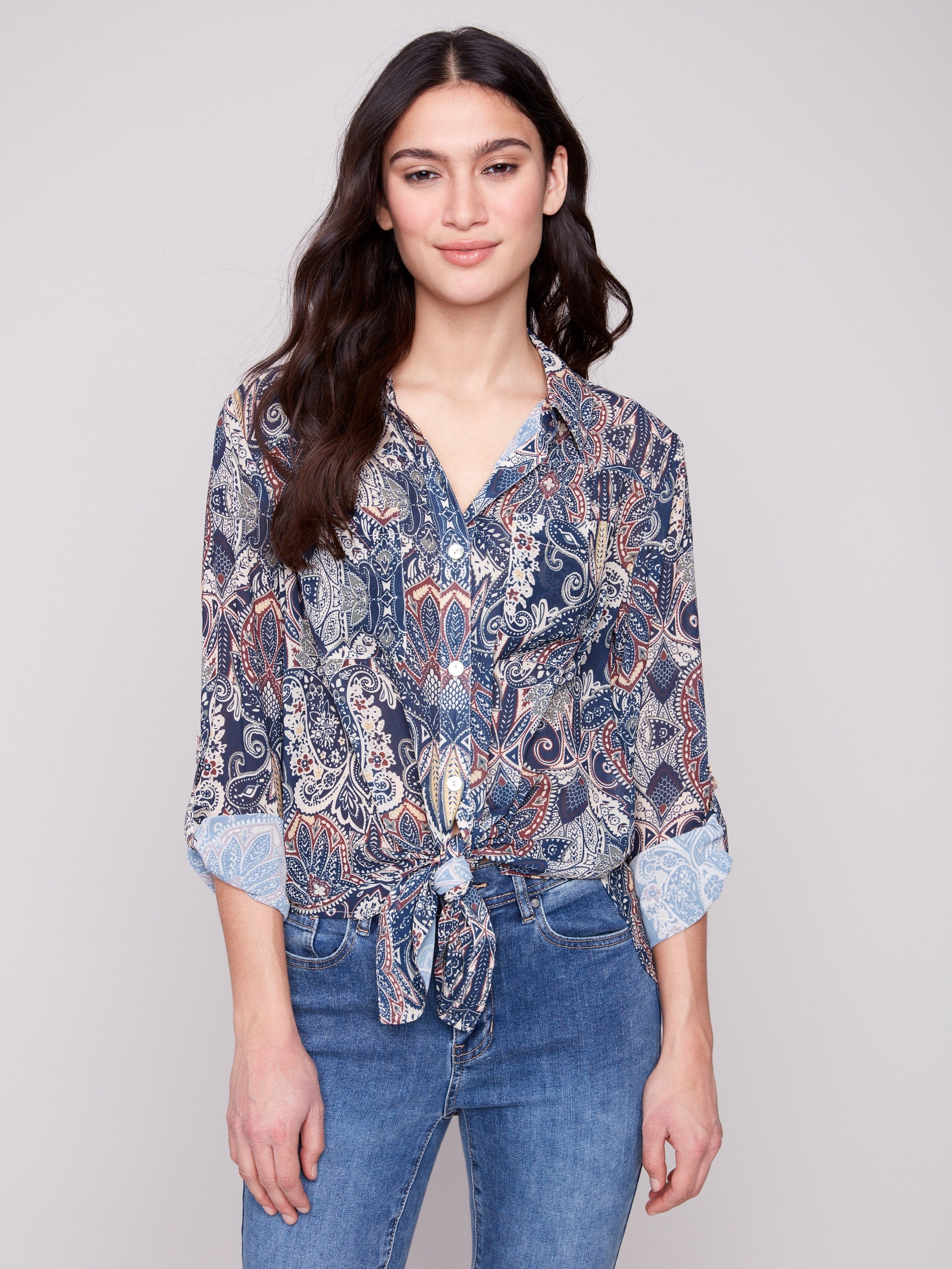 Elegant paisley blouse featuring a tie-front option and semi-sheer fabric for a chic look by Charlie B.