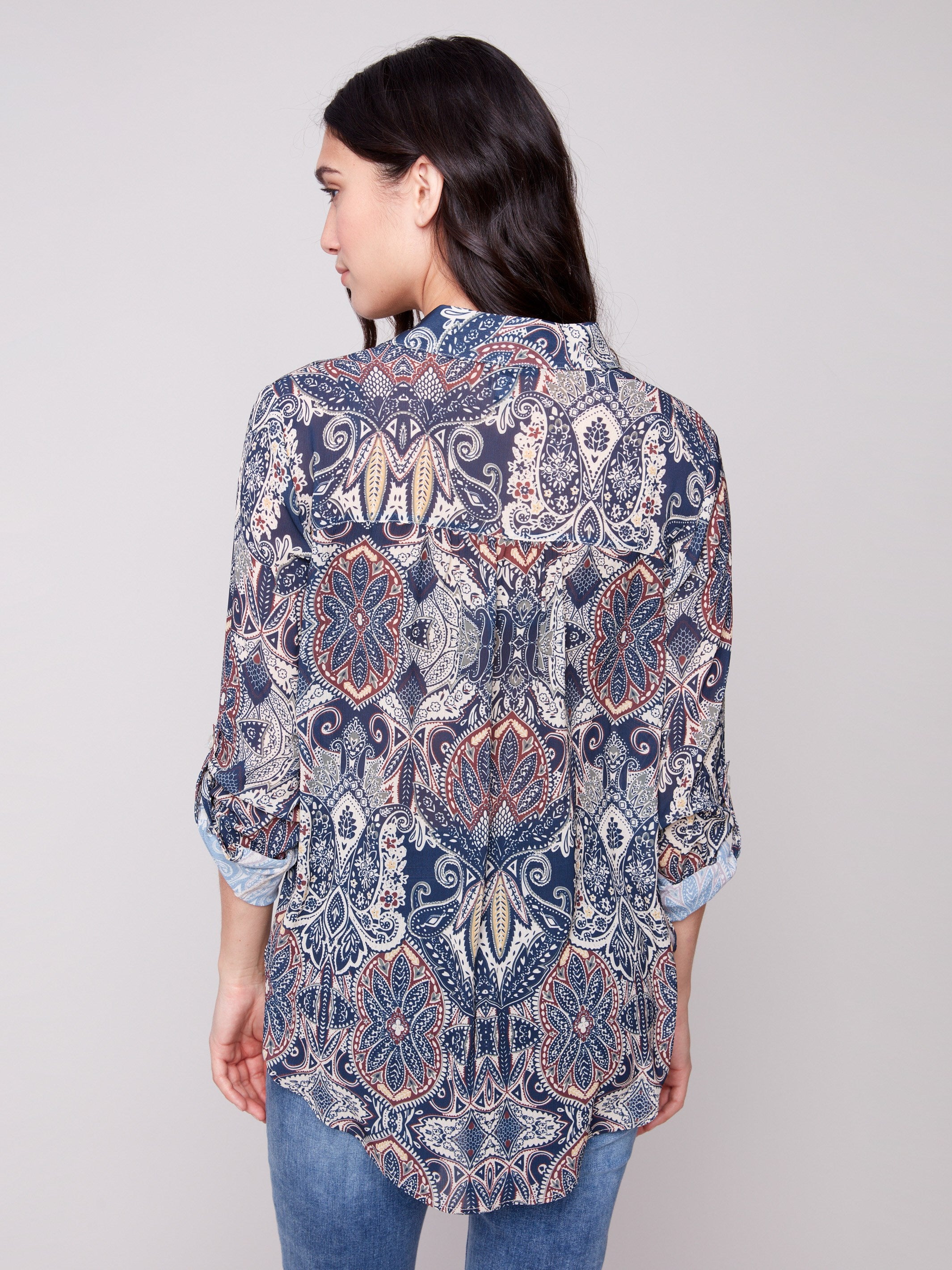 Paisley print blouse showcasing side slits and a comfortable fit, adding flair to any outfit by Charlie B.
