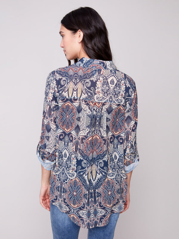 Paisley print blouse showcasing side slits and a comfortable fit, adding flair to any outfit by Charlie B.
