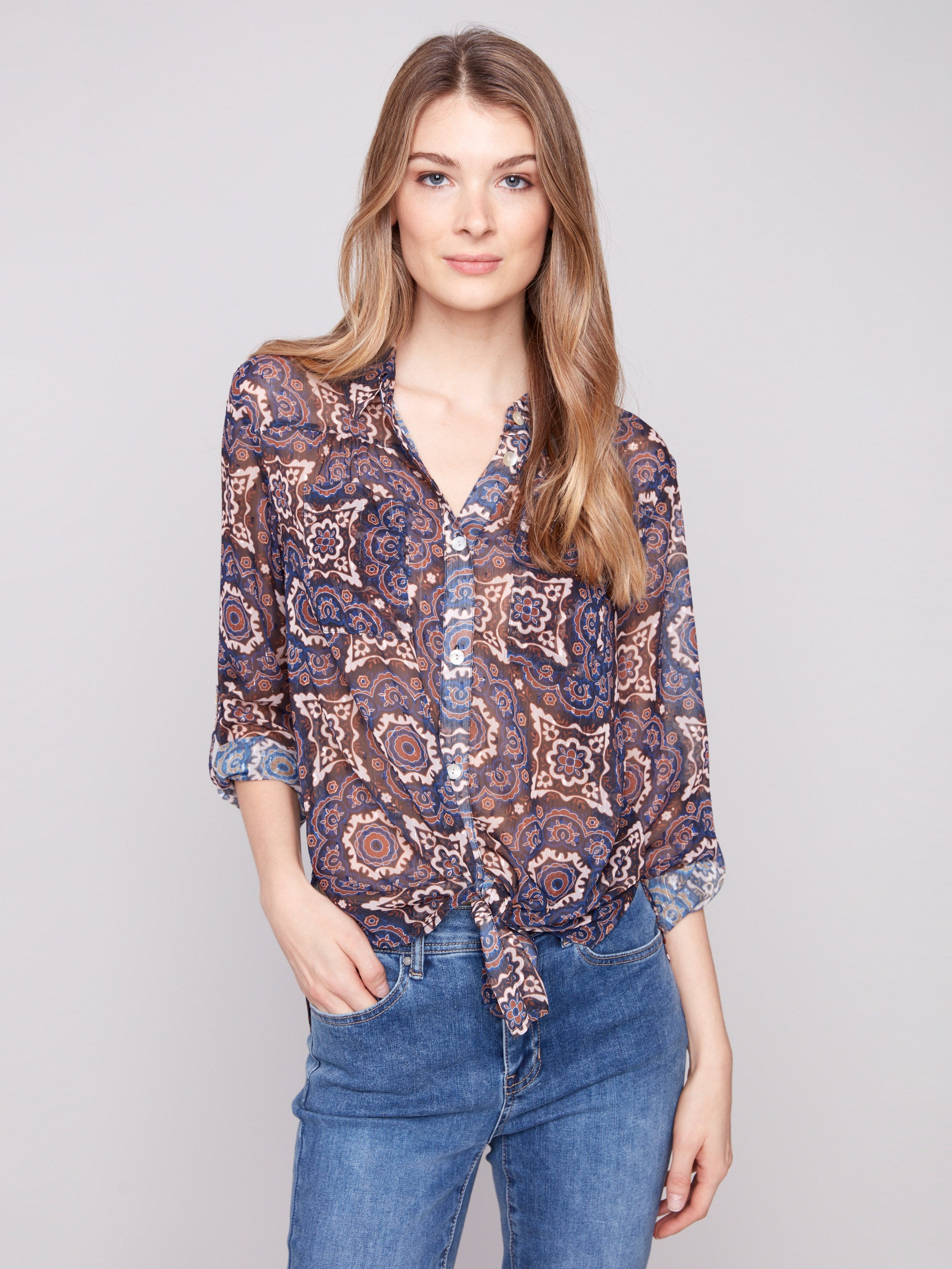 Button-down dobby blouse with a medallion pattern, offering a stylish tie-front option by Charlie B.