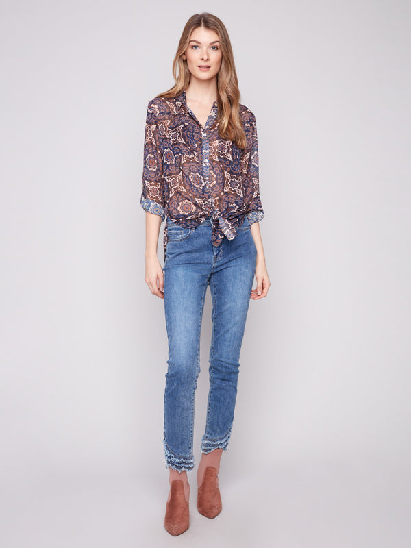 Stylish medallion print blouse with side slits and chest pockets for added flair by Charlie B.