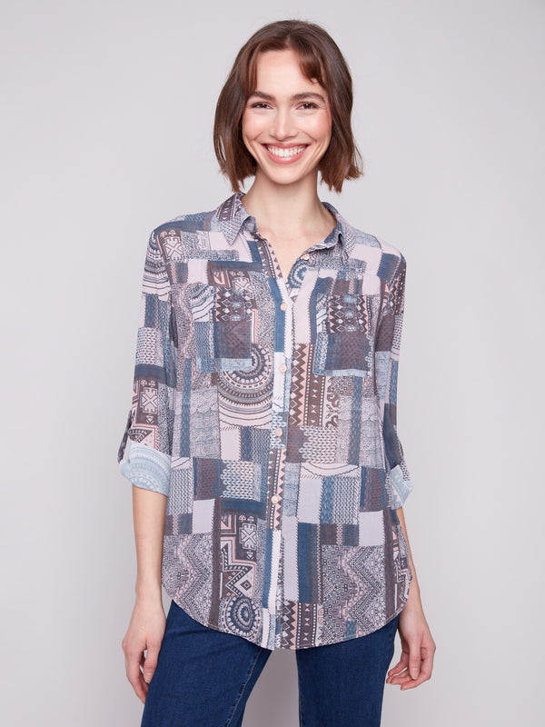 Semi-sheer patchwork blouse with chest pockets and adjustable roll-up sleeves, perfect for layering by Charlie B.