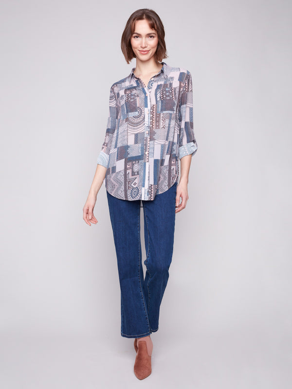 Long-sleeve blouse with shirt collar and side slits, offering a relaxed fit for everyday wear by Charlie B.